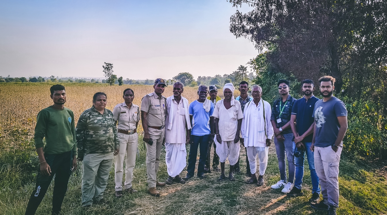 Fieldwork group with forest and village people